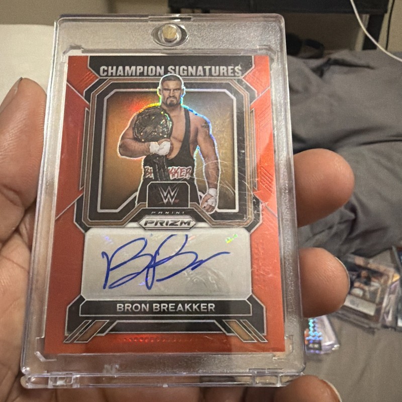 2023 Panini Prizm WWE Bron Breakker #CS-BBK Champion Signatures Red Prizm #89/99