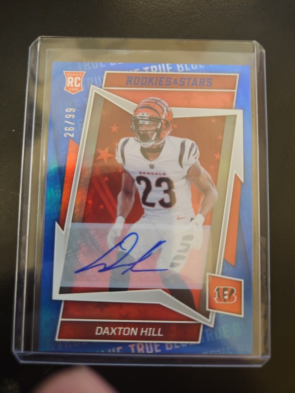 2022 Panini Rookies & Stars – Rookies Daxton Hill #182 (RC) True Blue /99 Auto